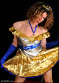 Shemale in shiny dress and pantyhose stuffs Obama dildo in her asspussy.